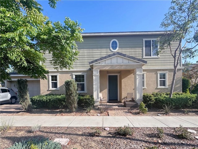 2944 E Via Terrano, Ontario, CA 91764 - view of front of property with stucco siding and a garage