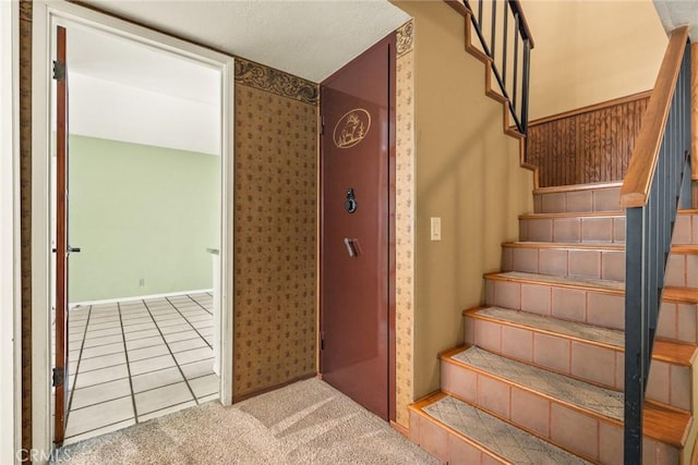 31 Pebblewood Pines Dr, Chico, CA 95926 - stairway featuring tile patterned flooring, wallpapered walls, and carpet floors