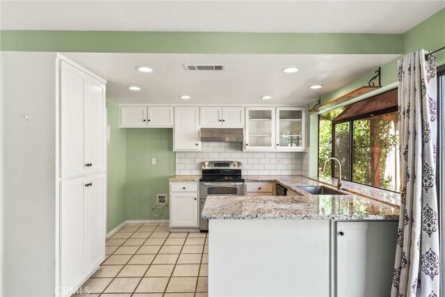 31 Pebblewood Pines Dr, Chico, CA 95926 - kitchen with electric range, under cabinet range hood, a peninsula, light stone counters, and white cabinets