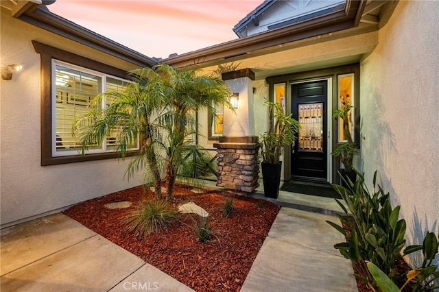 32872 Northshire Cir, Temecula, CA 92592 - exterior entry at dusk with stucco siding