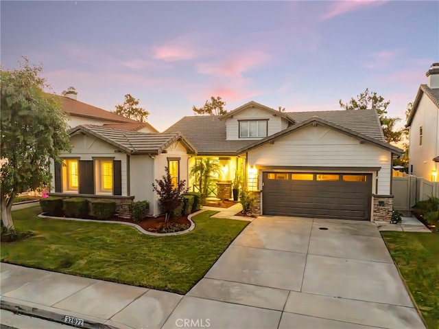 32872 Northshire Cir, Temecula, CA 92592 - view of front of house with concrete driveway, a garage, stone siding, a tile roof, and a chimney