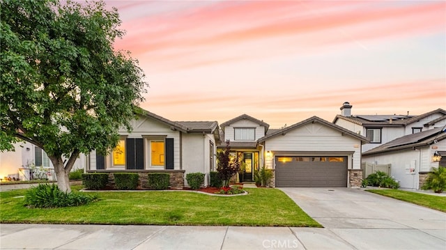 32872 Northshire Cir, Temecula, CA 92592 - view of front of home featuring concrete driveway, an attached garage, a front lawn, and stone siding