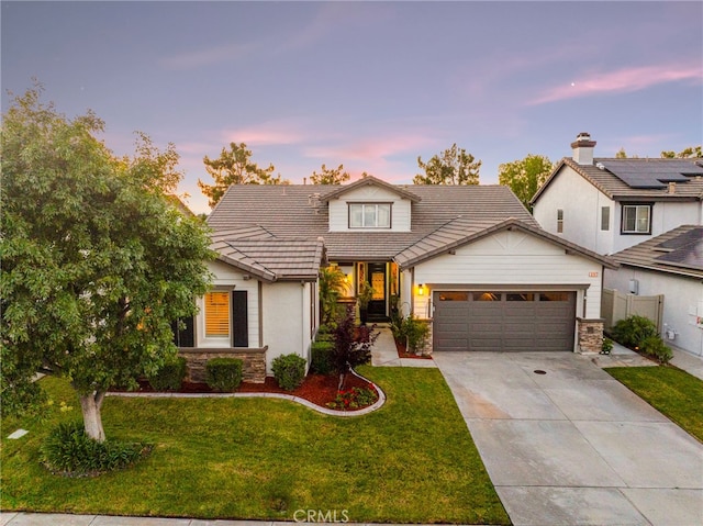 32872 Northshire Cir, Temecula, CA 92592 - traditional-style house with an attached garage, a tile roof, concrete driveway, a front yard, and stone siding