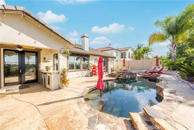 32872 Northshire Cir, Temecula, CA 92592 - view of swimming pool featuring french doors, a fenced backyard, a patio, and a pool with connected hot tub