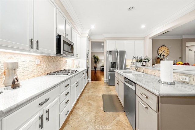 32872 Northshire Cir, Temecula, CA 92592 - kitchen featuring stainless steel appliances, ornamental molding, backsplash, white cabinets, and light stone countertops