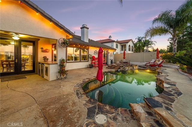 32872 Northshire Cir, Temecula, CA 92592 - pool at dusk with a patio area