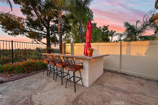 32872 Northshire Cir, Temecula, CA 92592 - patio terrace at dusk with a fenced backyard and a patio area