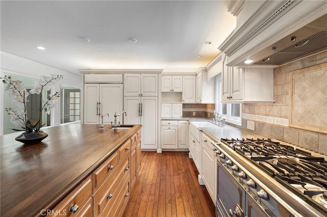 2030 Goldeneye Pl, Costa Mesa, CA 92626 - kitchen with ventilation hood, wooden counters, tasteful backsplash, white cabinets, and dark wood finished floors