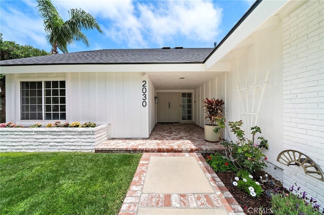 2030 Goldeneye Pl, Costa Mesa, CA 92626 - property entrance with a shingled roof and brick siding