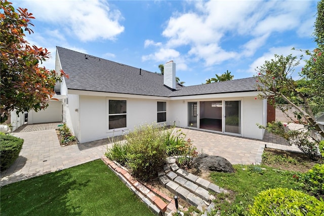 2030 Goldeneye Pl, Costa Mesa, CA 92626 - rear view of property featuring stucco siding, a patio area, a chimney, and roof with shingles