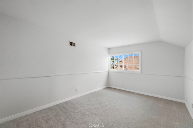 2030 Goldeneye Pl, Costa Mesa, CA 92626 - empty room featuring vaulted ceiling and carpet flooring