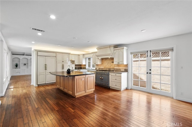 2030 Goldeneye Pl, Costa Mesa, CA 92626 - kitchen with premium appliances, french doors, dark wood-style floors, dark countertops, and recessed lighting
