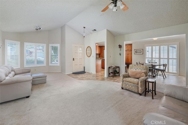 15144 Poppy Meadow St, Canyon Country, CA 91387 - living room featuring light carpet, a textured ceiling, ceiling fan, and high vaulted ceiling
