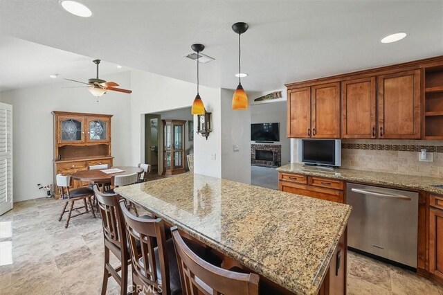 15144 Poppy Meadow St, Canyon Country, CA 91387 - kitchen featuring stainless steel dishwasher, open shelves, brown cabinetry, a ceiling fan, and light stone countertops