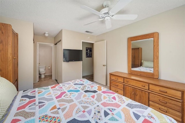 15144 Poppy Meadow St, Canyon Country, CA 91387 - bedroom featuring connected bathroom, a textured ceiling, ceiling fan, and light colored carpet