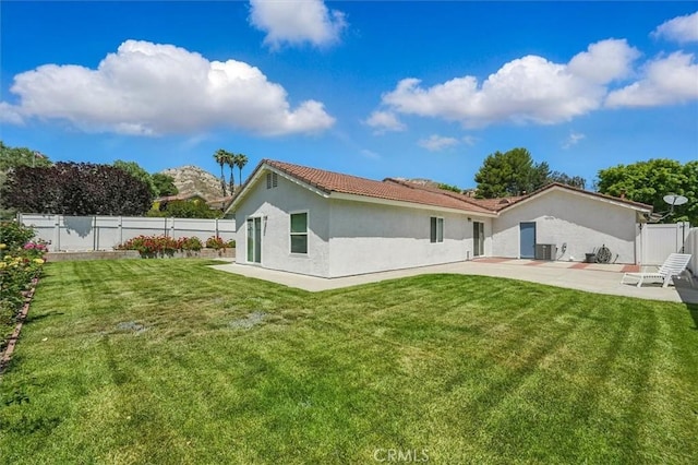 15144 Poppy Meadow St, Canyon Country, CA 91387 - back of property with a patio area, stucco siding, a fenced backyard, and a tiled roof