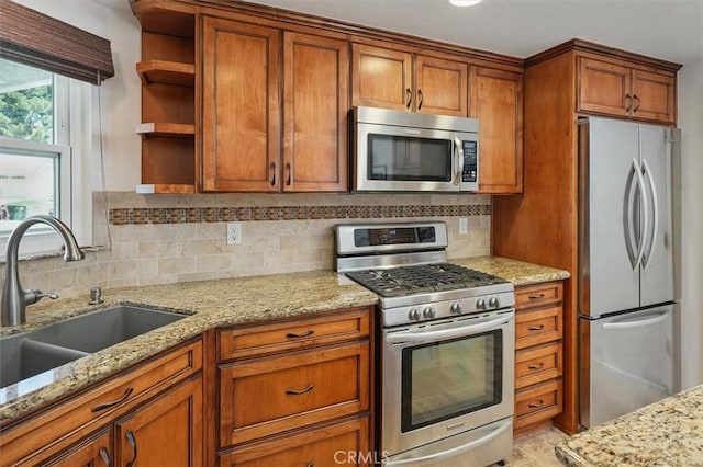 15144 Poppy Meadow St, Canyon Country, CA 91387 - kitchen with stainless steel appliances, open shelves, brown cabinets, and tasteful backsplash