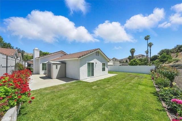 15144 Poppy Meadow St, Canyon Country, CA 91387 - rear view of house with a fenced backyard, a patio, stucco siding, and a tile roof