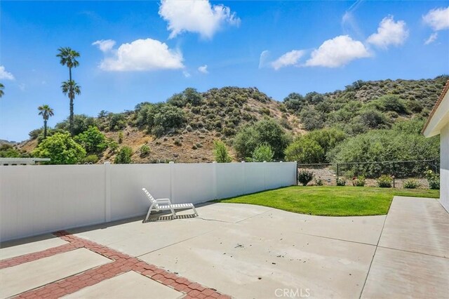 15144 Poppy Meadow St, Canyon Country, CA 91387 - fenced backyard featuring a patio area