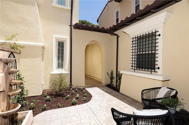 74 Townsend, Irvine, CA 92620 - entrance to property featuring stucco siding and a patio