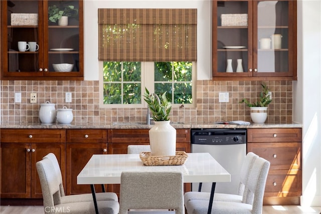 74 Townsend, Irvine, CA 92620 - kitchen featuring dishwasher, light stone counters, and backsplash