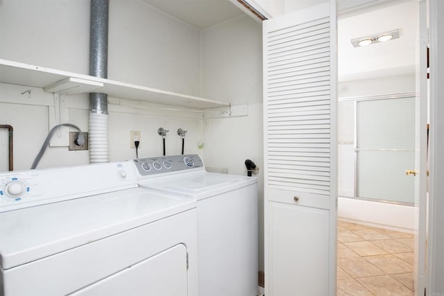 3621 Vista Campana S Unit 11, Oceanside, CA 92057 - laundry area featuring independent washer and dryer and light tile patterned floors