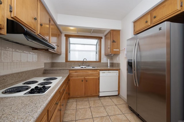 3621 Vista Campana S Unit 11, Oceanside, CA 92057 - kitchen featuring white appliances, decorative backsplash, light countertops, and under cabinet range hood