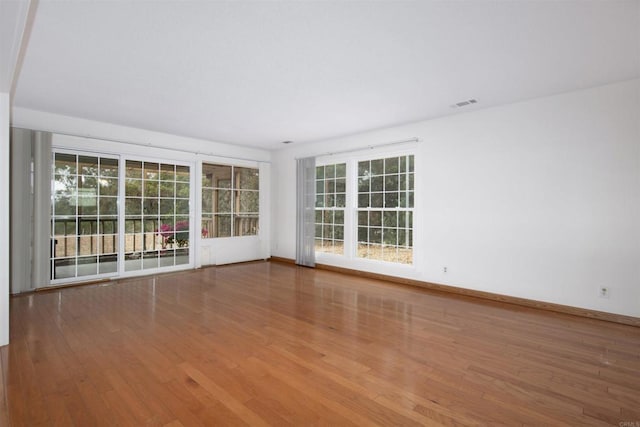 3621 Vista Campana S Unit 11, Oceanside, CA 92057 - empty room with wood finished floors