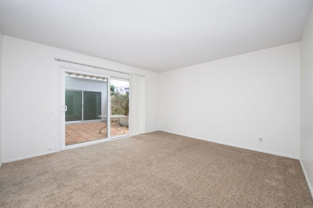 3621 Vista Campana S Unit 11, Oceanside, CA 92057 - empty room featuring carpet flooring