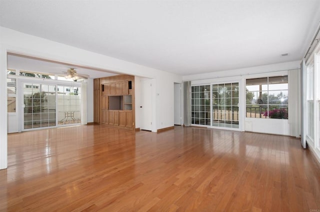3621 Vista Campana S Unit 11, Oceanside, CA 92057 - unfurnished living room featuring wood finished floors and a ceiling fan