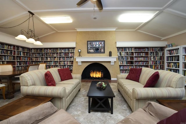 3621 Vista Campana S Unit 11, Oceanside, CA 92057 - living area with wall of books, vaulted ceiling, a ceiling fan, and built in features
