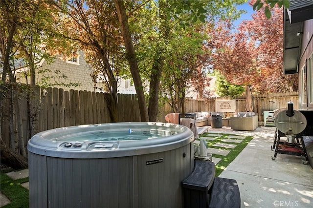 345 Maple Dr, Lake Arrowhead, CA 92352 - fenced backyard featuring a hot tub, a patio, and an outdoor living space
