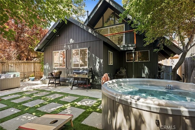 345 Maple Dr, Lake Arrowhead, CA 92352 - back of property with a hot tub and a patio area