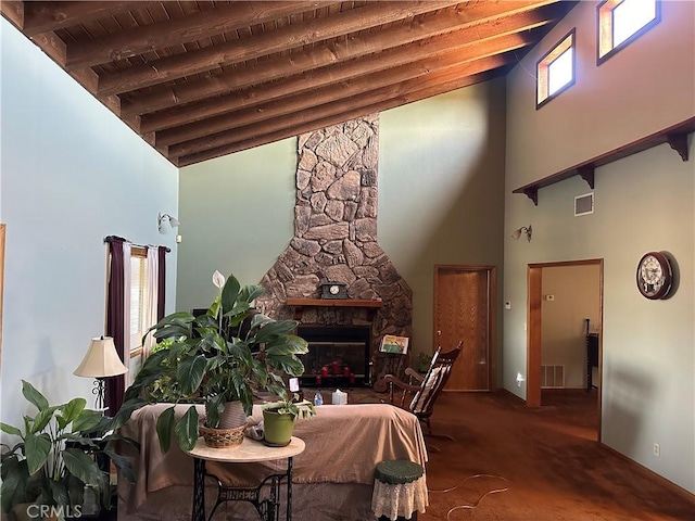 18211 Hercules St, Hesperia, CA 92345 - carpeted dining area with high vaulted ceiling, a stone fireplace, and a wooden ceiling with exposed beams