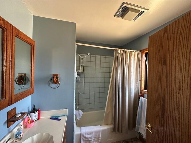 18211 Hercules St, Hesperia, CA 92345 - bathroom with shower / bath combination with curtain and vanity