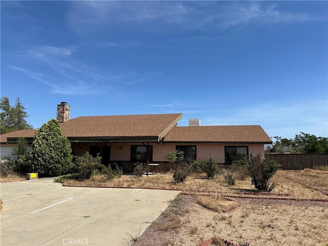 18211 Hercules St, Hesperia, CA 92345 - ranch-style home with a chimney and stucco siding