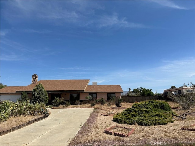 18211 Hercules St, Hesperia, CA 92345 - single story home featuring a chimney, an attached garage, stucco siding, and driveway