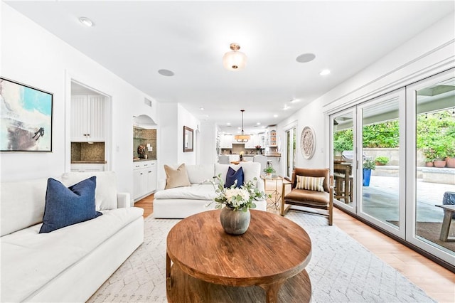 2726 Cardinal Dr, Costa Mesa, CA 92626 - living area with light wood-style floors and recessed lighting