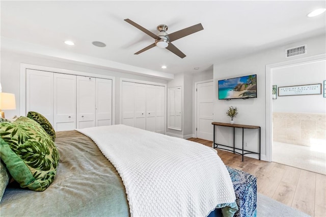 2726 Cardinal Dr, Costa Mesa, CA 92626 - bedroom featuring multiple closets, recessed lighting, wood finished floors, connected bathroom, and a ceiling fan