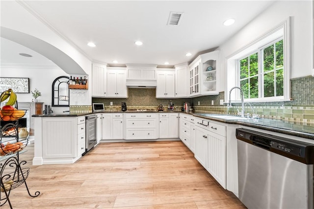 2726 Cardinal Dr, Costa Mesa, CA 92626 - kitchen with stainless steel dishwasher, a peninsula, dark countertops, beverage cooler, and white cabinetry