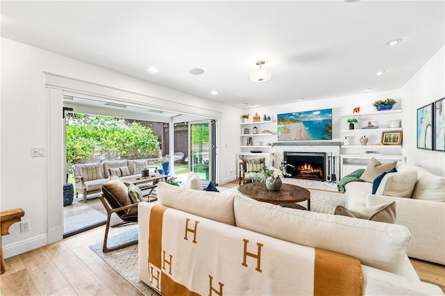 2726 Cardinal Dr, Costa Mesa, CA 92626 - living room featuring light wood-type flooring, a high end fireplace, and recessed lighting