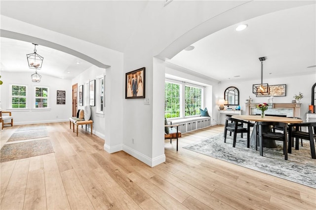 2726 Cardinal Dr, Costa Mesa, CA 92626 - dining area featuring arched walkways, plenty of natural light, light wood-style floors, lofted ceiling, and recessed lighting