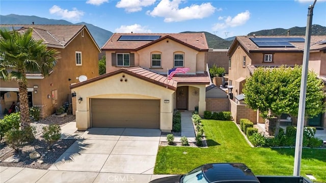 3871 Bur Oak Rd, San Bernardino, CA 92407 - mediterranean / spanish-style house with stucco siding, a mountain view, roof mounted solar panels, and concrete driveway
