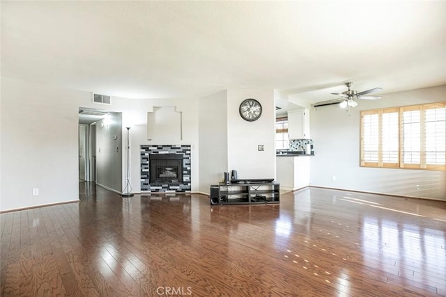 18110 Erik Ct Unit 593, Canyon Country, CA 91387 - living area featuring ceiling fan, hardwood / wood-style flooring, healthy amount of natural light, and a tiled fireplace