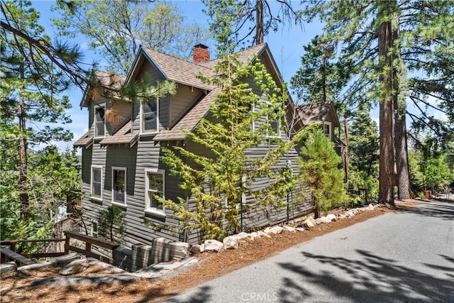 600 Rose Ln, Twin Peaks, CA 92391 - view of side of property with a chimney and roof with shingles