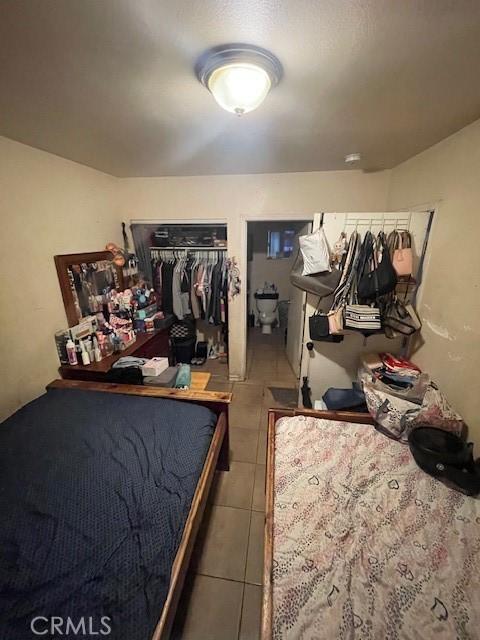 8014 Morton Ave, Los Angeles, CA 90001 - tiled bedroom featuring a closet