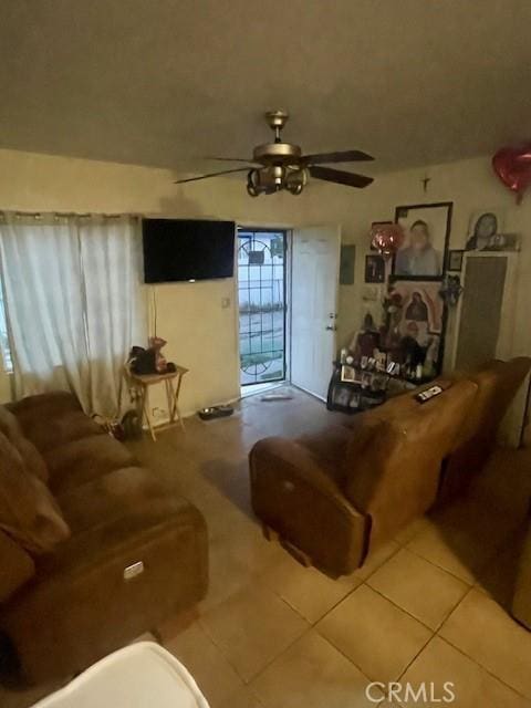 8014 Morton Ave, Los Angeles, CA 90001 - living area with a ceiling fan and tile patterned flooring