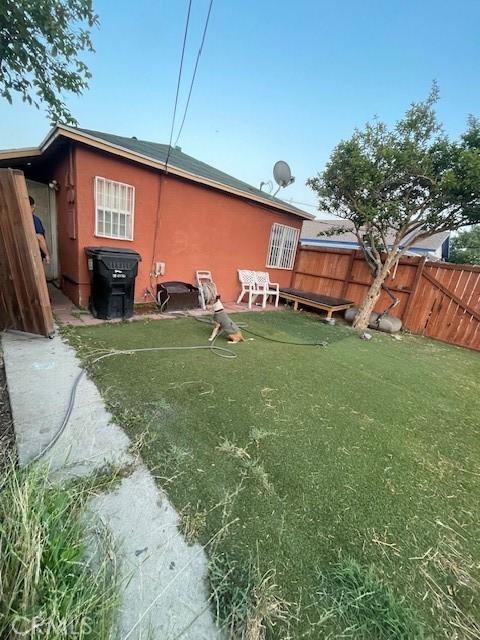 8014 Morton Ave, Los Angeles, CA 90001 - rear view of house featuring stucco siding