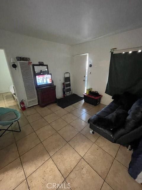 8014 Morton Ave, Los Angeles, CA 90001 - living room featuring light tile patterned flooring and a heating unit