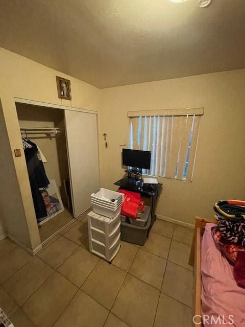 8014 Morton Ave, Los Angeles, CA 90001 - bedroom featuring light tile patterned flooring and a closet